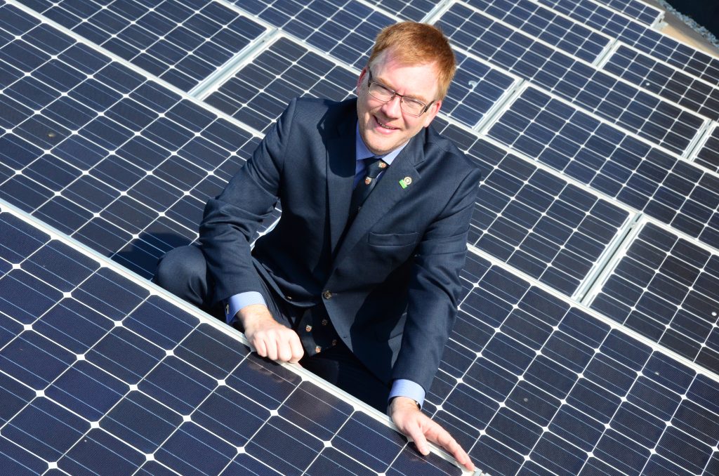 Warren photographed with PV solar panels